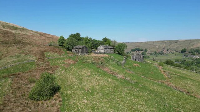 Drone footage of a derelict farmhouse and outbuildings on Marsden Moor, Yorkshire, England