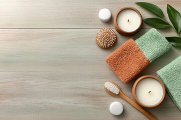 Relaxing spa essentials arranged on a wooden table with soft towels, candles, and natural accessories for a rejuvenating experience