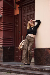 street style fashion girl model in a stylish look on the street.