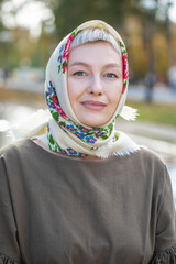 Russian beauty - young beautiful woman in a traditional headscarf