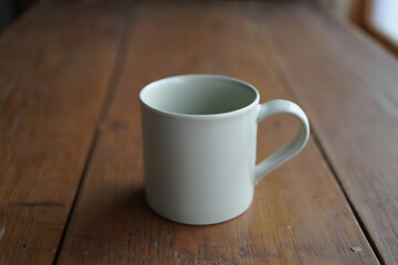 Light Green Mug Wooden Table Stock Photo