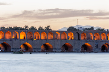 Historical Persian Khaju Bridge in Isfahan, Iran at sunset