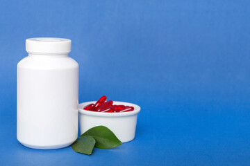 different drugs and health supplement pills with medicine bottle health care and medical top view. Vitamin tablets. Bottle with colored pills on table background. Multivitamins