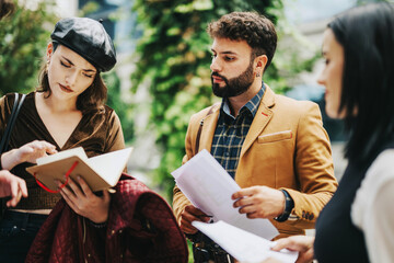 A diverse group of professionals engaged in a strategic discussion outdoors. The team analyzes data, sharing insights from documents. The collaborative atmosphere emphasizes teamwork and innovation in