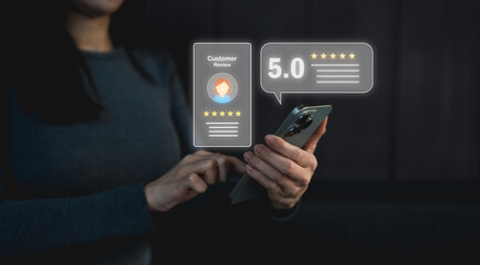 A person using a smartphone to view or leave a five-star customer review rating online.