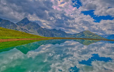 View on a lake and mountains above Defereggental valley on a summer day