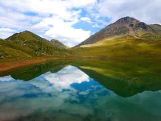 View on a lake and mountains above Defereggental valley on a summer day