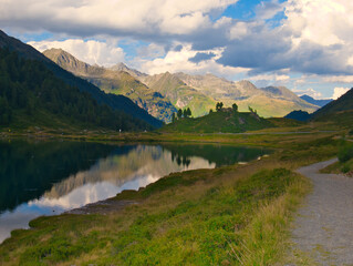 View on Obersee lake and mountains above Defereggental valley on a summer day