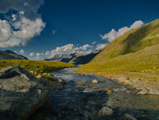 View from a Weissee lake to the Kaunertal valley on a summer evening