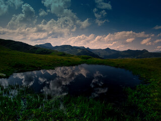 Mountain lake near Saalbach Hinterglemm Leogang ski resort during summer day