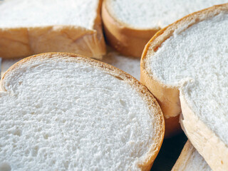 Close-up of freshly sliced ​​soft and fragrant bread with white bread,brown bread crust macro