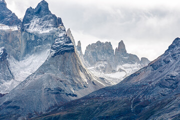 Dramatic close-up of the rugged granite peaks of Cuernos del Paine and the French Valley in Torres del Paine National Park.