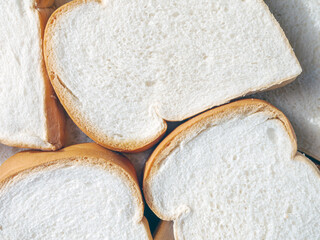 Close-up of freshly sliced ​​soft and fragrant bread with white bread,brown bread crust macro