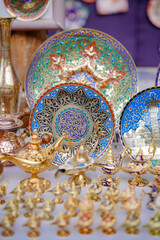 Souvenir shop. A random local souvenir shop in Bukhara bazaar street market including colorful dishes and lamps on display.