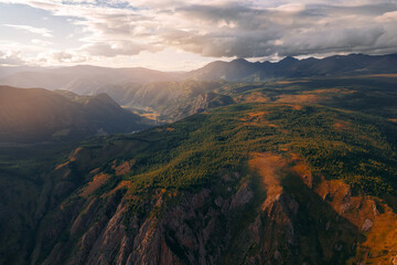 Fototapeta premium Beautiful autumn landscape with yellow trees Altai mountains, Siberia, Russia. Aerial top view photo