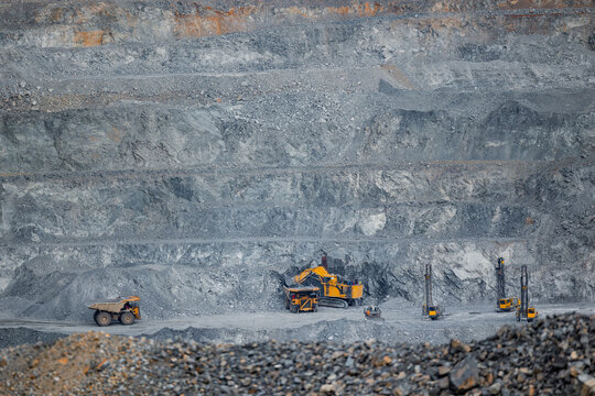 Aerial View Work of heavy equipment in open pit mine.
