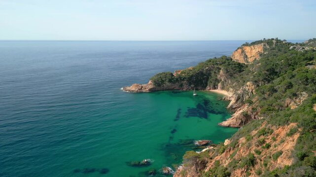 Breathtaking tossa de mar coastline embraces emerald mediterranean waters