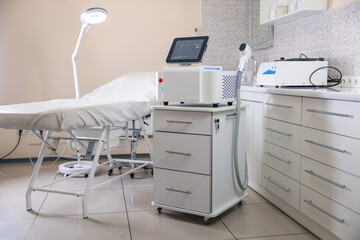 Laser hair removal machine and medical couch in beauty salon