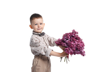 Little boy with bouquet of lilac flowers on white background