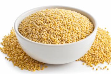 A bowl filled with yellow grains placed on a white table, often used as a still life for photography or art