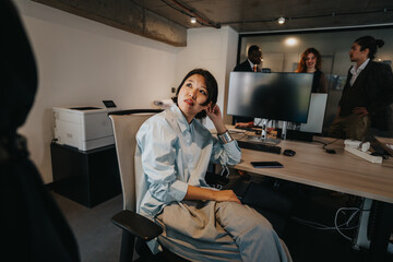 A diverse group of professionals brainstorming ideas in a contemporary office, promoting collaboration and innovation.