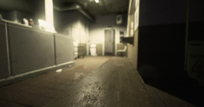 A dimly lit hallway reveals old tiles and washed out walls in an abandoned structure. The faint glow highlights the eerie atmosphere, emphasizing neglect and solitude.