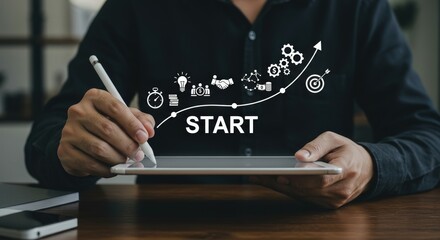 Man using a tablet with stylus, displaying a business start up strategy with icons and upward trend line.