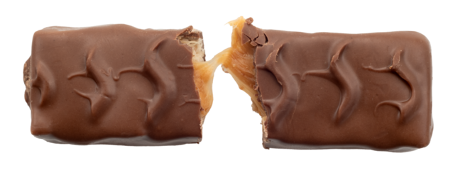 Bar with peanuts, hazelnuts, caramel and chocolate on a white background. View from above. Nut bar isolate. Sugar