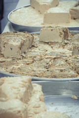 Halva with vanilla and pistachio on stall at bazaar. High calorie snack