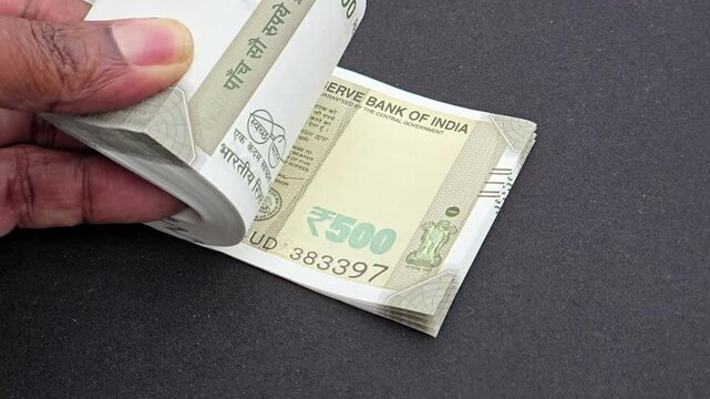 Flipping Indian Rupees 500