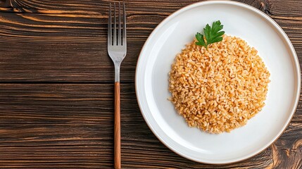 Light Brown Rice on White Plate with Fork, Dark Wooden Background