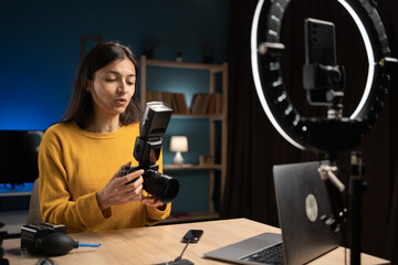 Female photographer content creator with smartphone at home for social media, online vlog, and live...