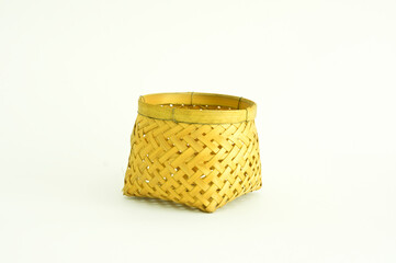 Small wicker bamboo basket isolated on white background.