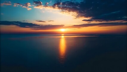 Obraz premium Serene Sunset over Calm Ocean A Breathtaking View of Nature's Golden Hour
