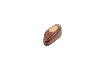 Oval praline with caramel center on white background. This oblong praline has a smooth milk chocolate shell and an oval caramel center. The perfect balance between shape and filling.