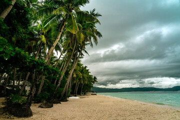 sea, sun and sand. White sand beach with blue water, white sand and palm trees. Summer vacation vibes. Beaches in asia.