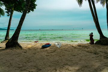 sea, sun and sand. White sand beach with blue water, white sand and palm trees. Summer vacation vibes. Beaches in asia.