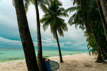 sea, sun and sand. White sand beach with blue water, white sand and palm trees. Summer vacation vibes. Beaches in asia.