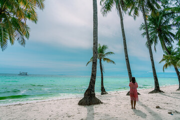 sea, sun and sand. White sand beach with blue water, white sand and palm trees. Summer vacation...