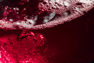 Red wine abstract splashing in glass.