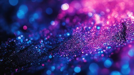 Abstract glitter background with pink and blue sparkling bokeh lights