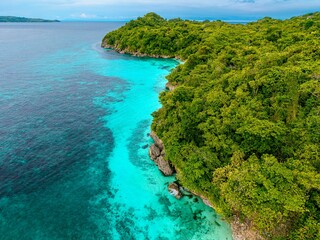 sea, sun and sand. Beach with palm trees with blue water, white sand. Summer holiday vibes. Beaches in Asia. 