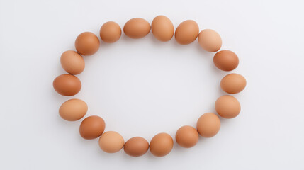 Obraz premium Fresh brown eggs in a circular pattern on white, symbolizing simplicity and natural harmony.