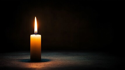 Candle lighting another candle in dark room addressing poverty emotional reflection intimate setting hopeful concept