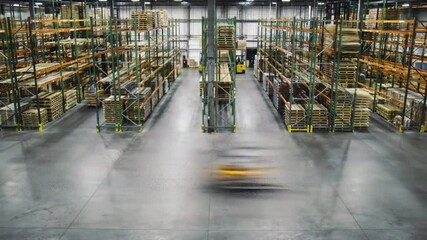 Timelapse of forklift operating inside warehouse storage facility with busy logistics activity - Powered by Adobe