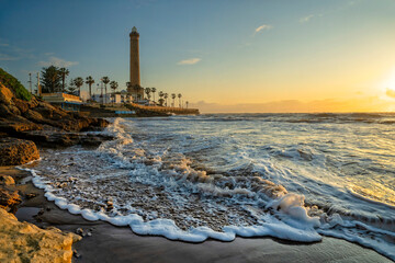 Chipiona, Spain. Chipiona Lighthouse on the Ocean Shore  © Alvov