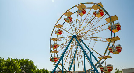 ferris wheel,  amusement park,  carnival, Ferris Wheel Against a Blue Sky