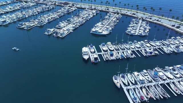 Aerial Long Beach city California marina overhead 3. Coastal city near Los Angeles. Cargo and container ship terminal. Cruise ship destination. Seaside resort boat marina and park.