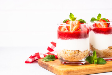 Strawberry cheesecake in glass, healthy dessert.