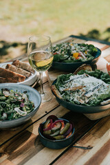 A field of flowers with a few white flowers in the foreground. The flo